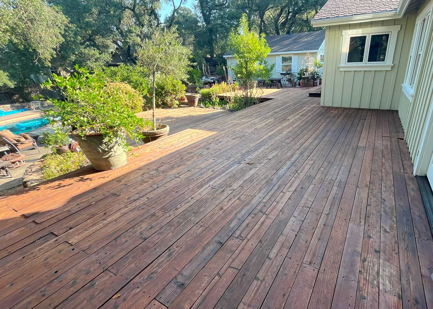 A hardwood deck after getting re-stained by Zen Painting A hardwood deck after getting re-stained by Zen Painting